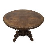 Late 19th Century continental Oak oval centre table/ dining table with carved 'Green Man' Gothic ...