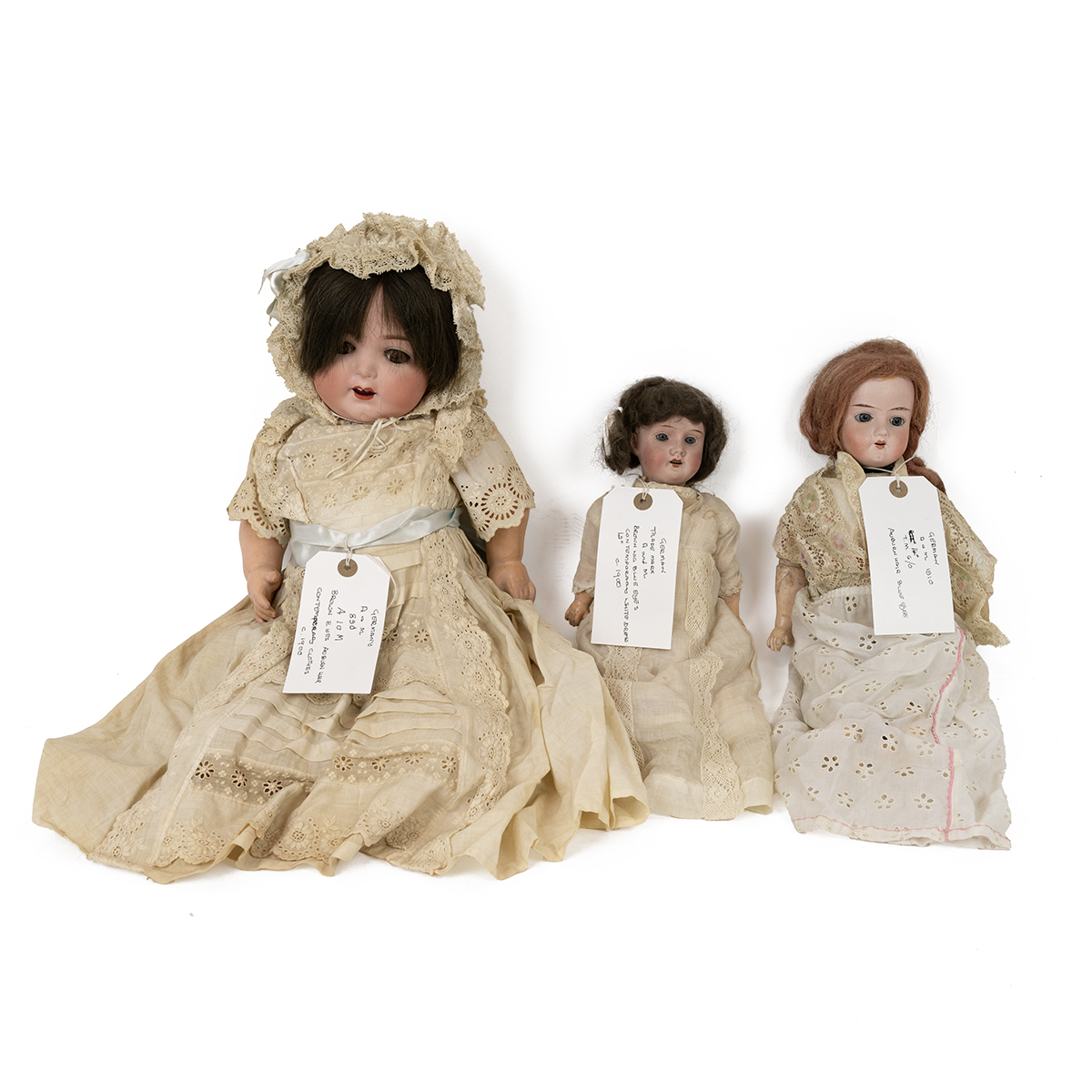 German Armand Marsaille dolls c1900 (3). Tallest 19 inch bisque  with opening eyes in period clot...