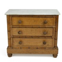 An early 20th-century burr maple veneer apprentice chest of drawers, with a white marble top, fau...