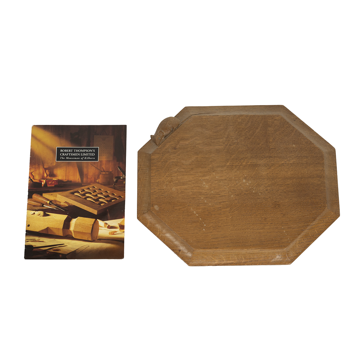 Robert 'Mouseman' Thompson of Kilburn, a 20th-century oak octagonal chopping board with a carved ...