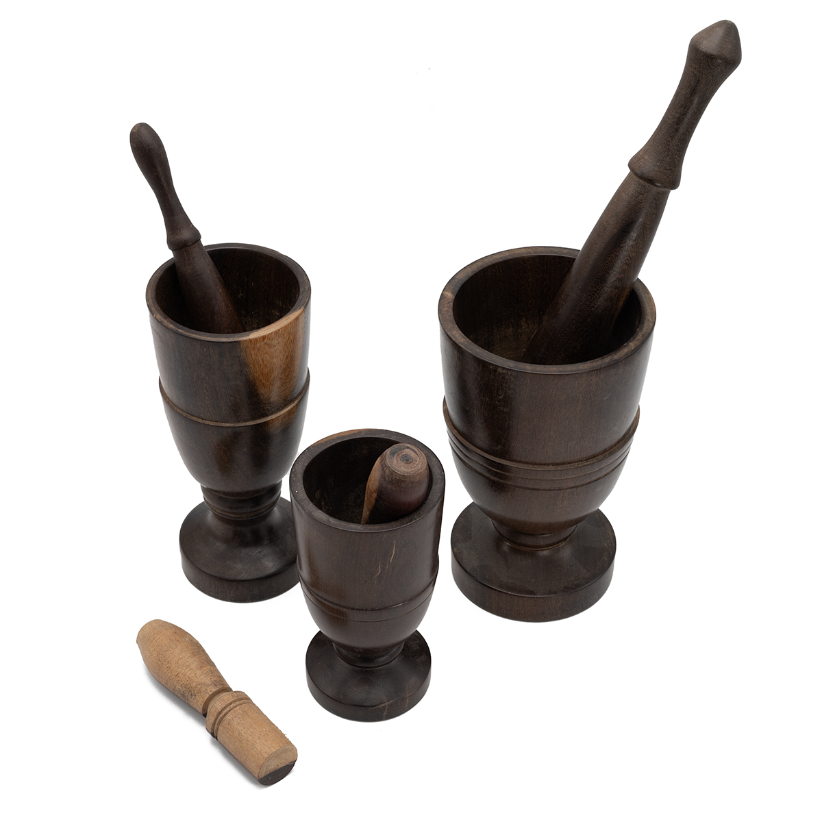 Three turned wooden goblet shaped  mortars with four various turned wooden pestles. (7). - Bild 2 aus 2