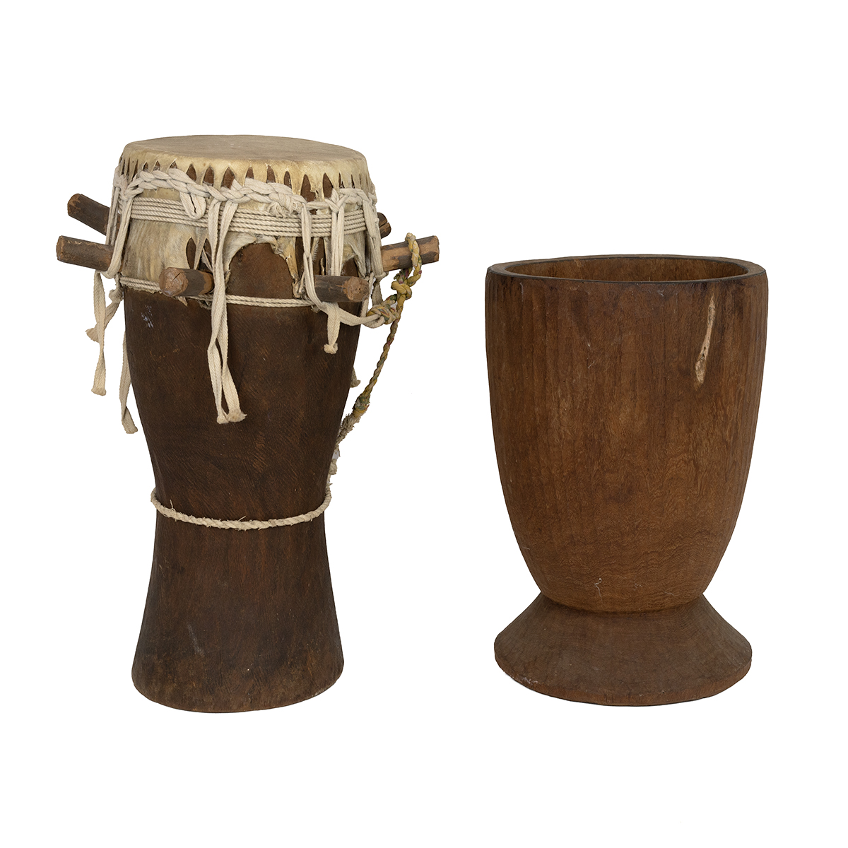 Traditional African hardwood drum (H 52cm) and a hardwood mortar for pound grain or roots (H 41cm...