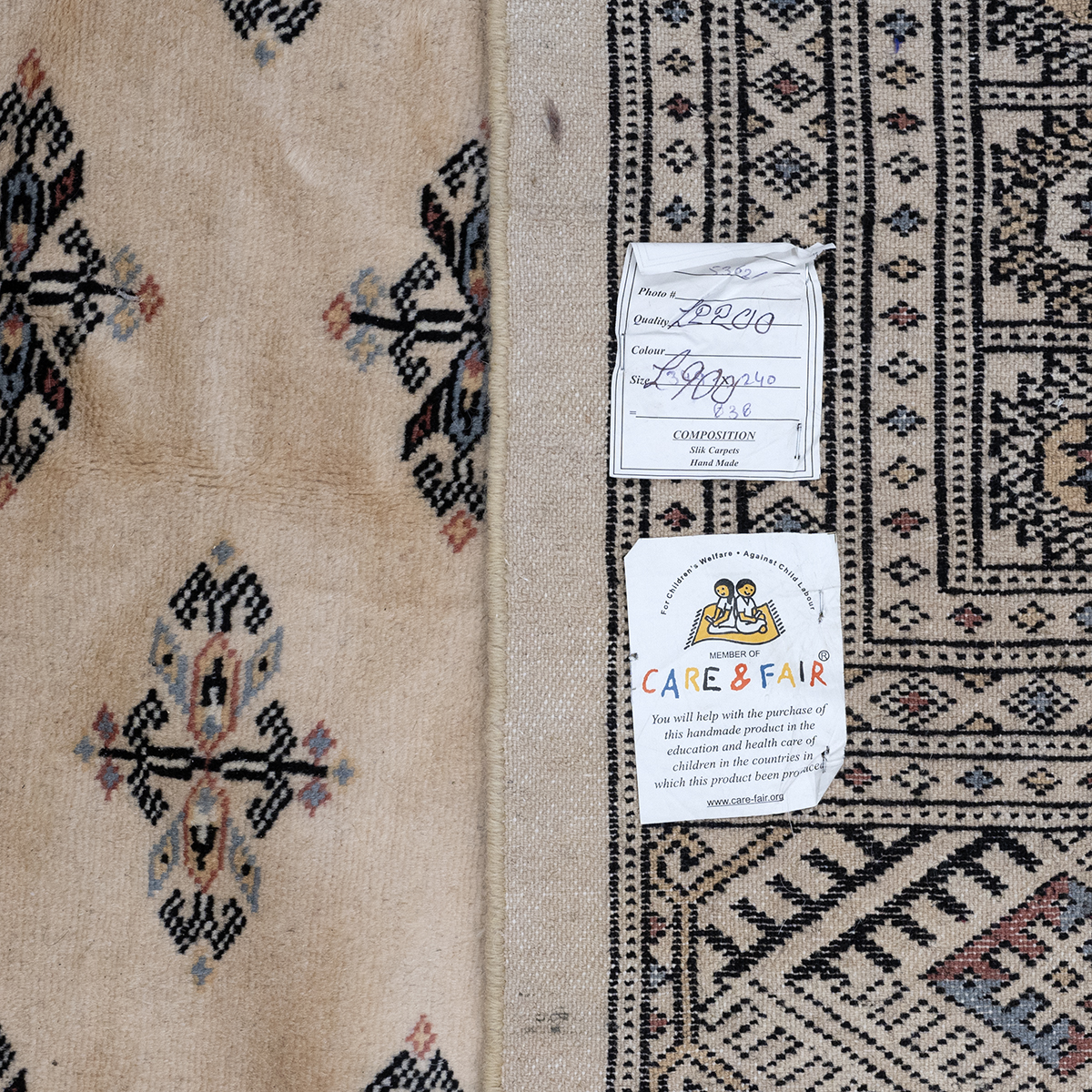 Large Contemporary Bukhara pattern hand made rug. Cream/ Camel coloured ground with black geometr... - Image 2 of 2