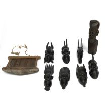 Collection of ebony figurines and a hand loom or heddle, all from Central or West Africa. (9)