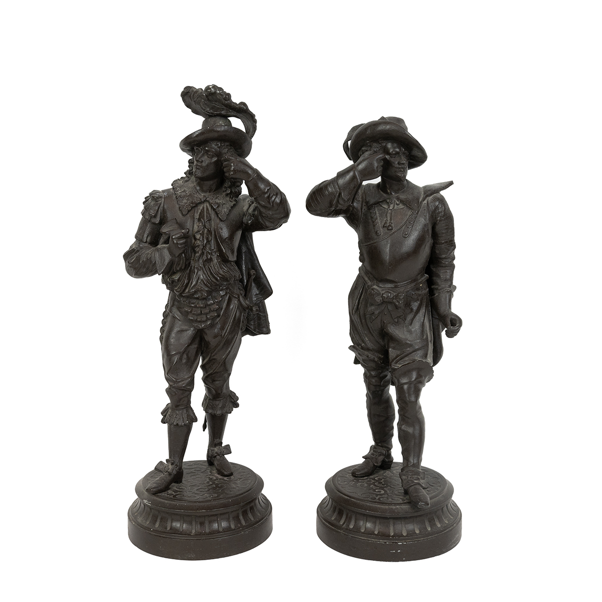 Pair of Spelter figures of Cavaliers. Each standing on raised pedestal bases. Each H 47cm.