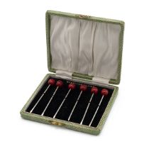Cased set of sterling silver cocktail sticks with cherry finials. Gross weight 19.7g.