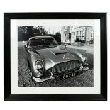 James Bond Interest. Large Framed black and white photographic print of an Aston Martin DB7 with ...