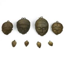 West African miniature Baule masks - eight in total - ranging in size from 4.5cm to 13cm. (8)