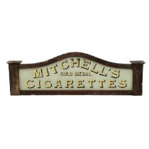 Antique 'Mitchell's gold medal Cigarettes' shop sign c1900. Stained wood frame with reverse appli...