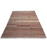 Vintage kilim rug, hand-knotted with a multi-coloured ground, with repeating patterns throughout....