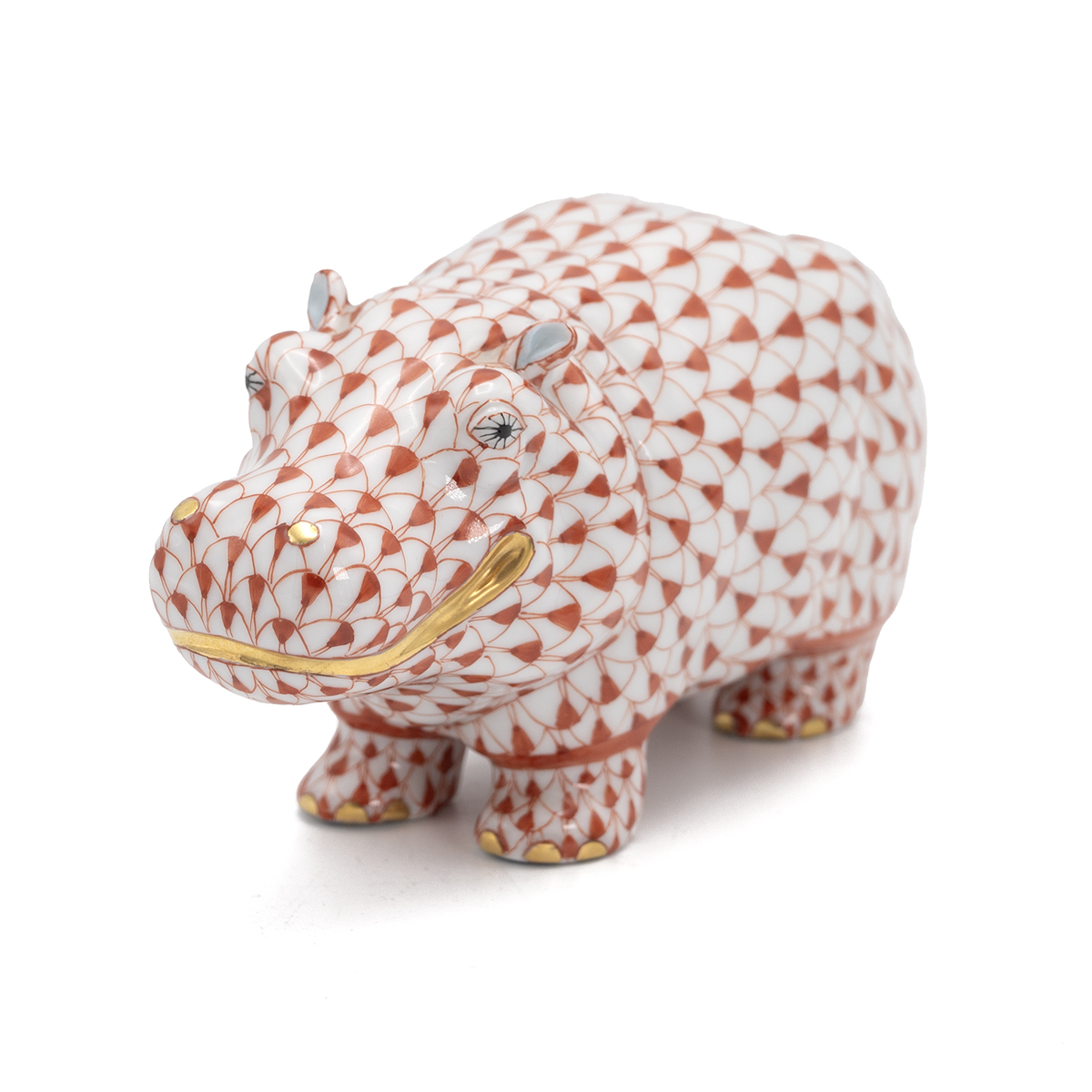 Herend red fishnet pattern Hippopotamus with gold highlights, marked to underside with Herend pri...