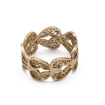 An African yellow metal ring, the band decorated with hearts and filigree decoration tested as 14...