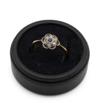 A sapphire and rose diamond cluster ring, the shank marked "18ct", finger size Q 1/2, 2g gross.