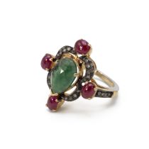 Emerald, ruby and diamond ring. The central emerald enclosed by rose cut diamonds and rubies at t...