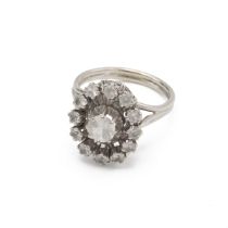 French white sapphire cluster ring, the thirteen stones to a white wire work mount with French co...