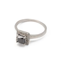 A sapphire and diamond platinum cluster ring, the square cut stone enclosed by twenty small brill...