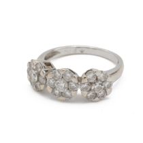 Triple diamond cluster ring, composed of twenty one brilliant cuts, estimated as totalling approx...
