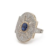 Sapphire and diamond panel ring, the central oval cut sapphire estimated as weighing approximatel...
