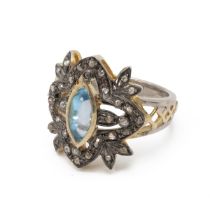 Cluster ring set with diamonds around a central blue topaz cabochon, finger size N.