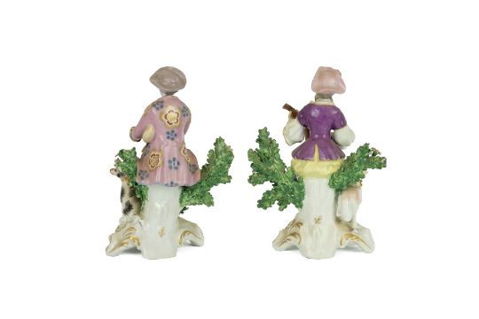 Two Chelsea style porcelain figurines of a gentleman playing bagpipes with his hound at foot, and... - Image 2 of 2