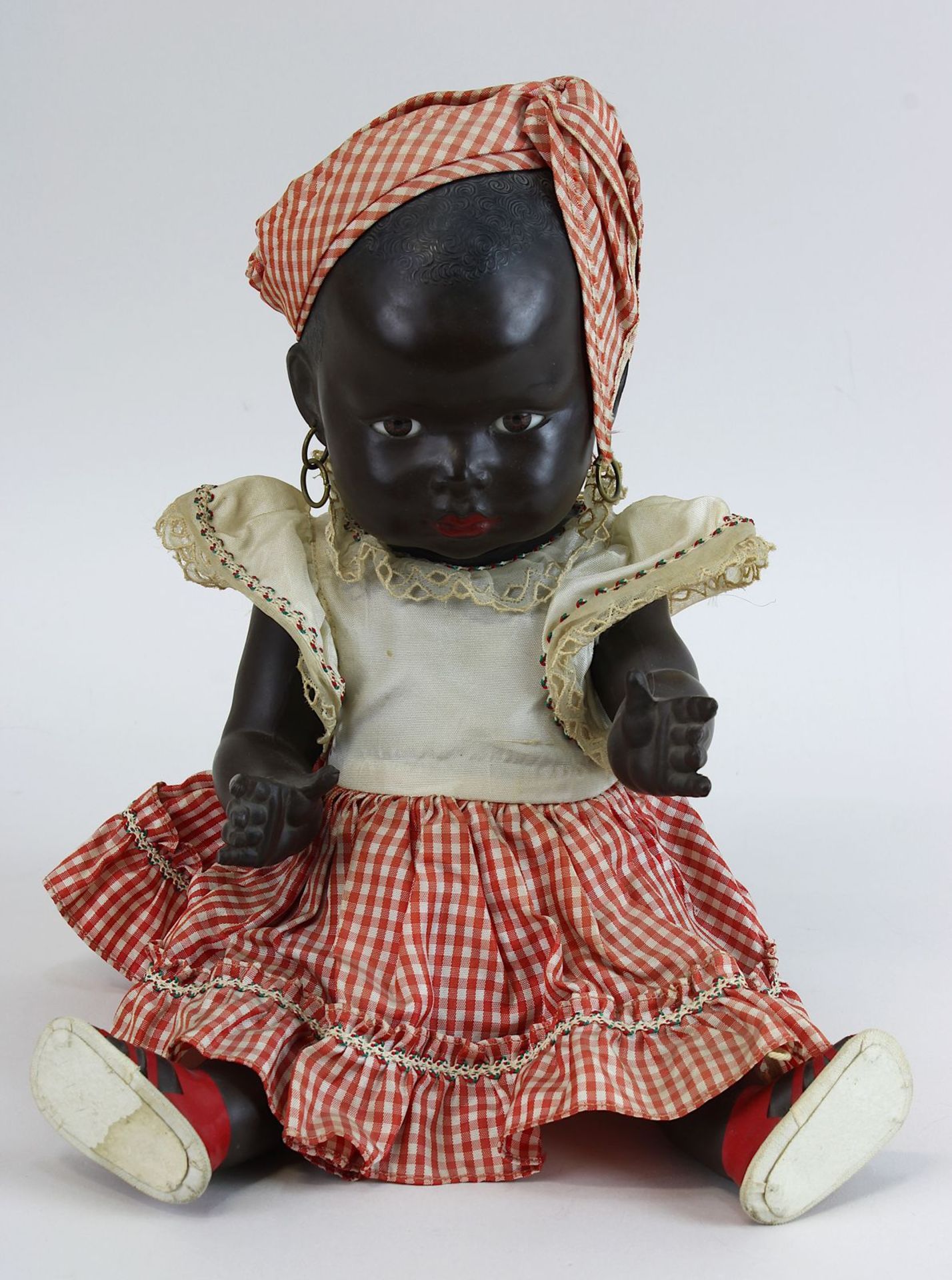 Petitcollin - Afrikanische Kleinkinderpuppe mit Kleidung aus Zelluloid, Frankreich 1930-1950, mit