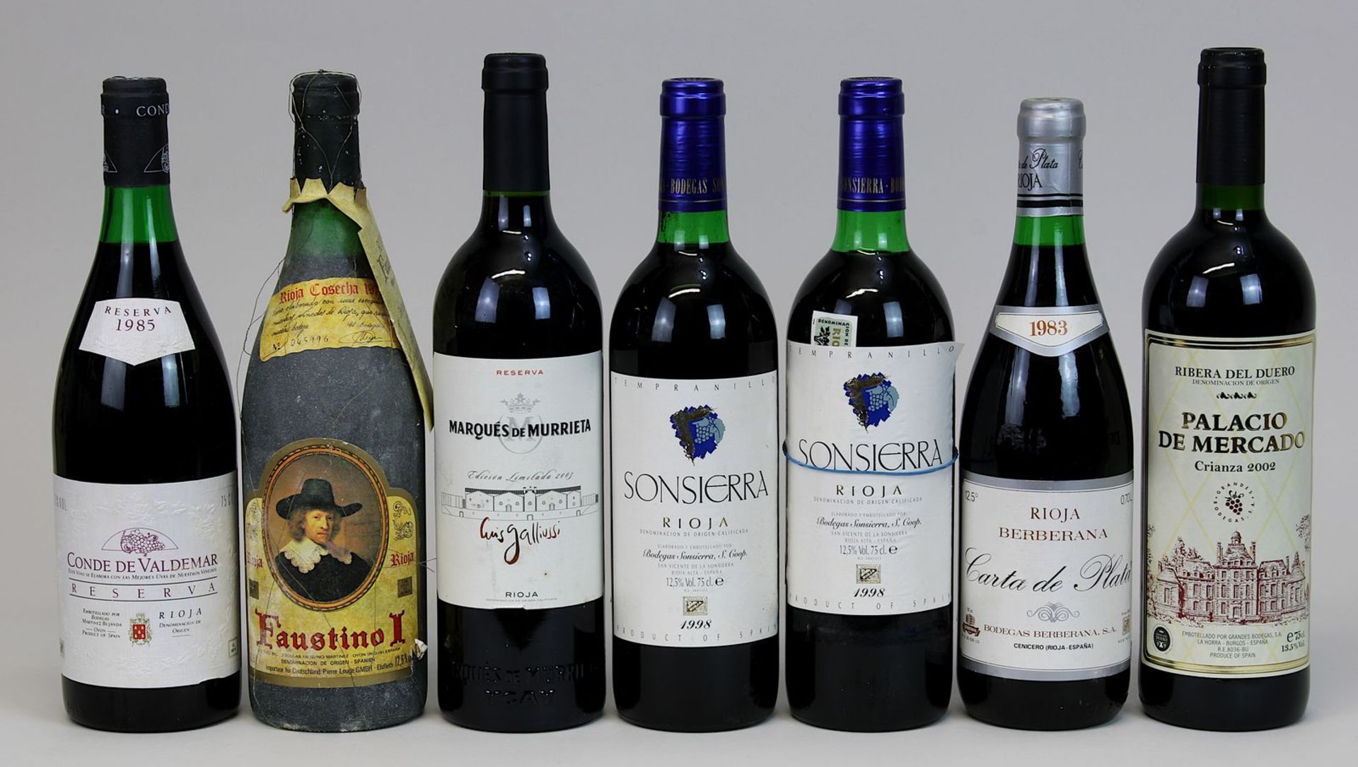7 Flaschen Rotwein: eine Flasche 1975er Faustino, Rioja, Cosecha, Oyon; eine Flasche 1983er Carta de