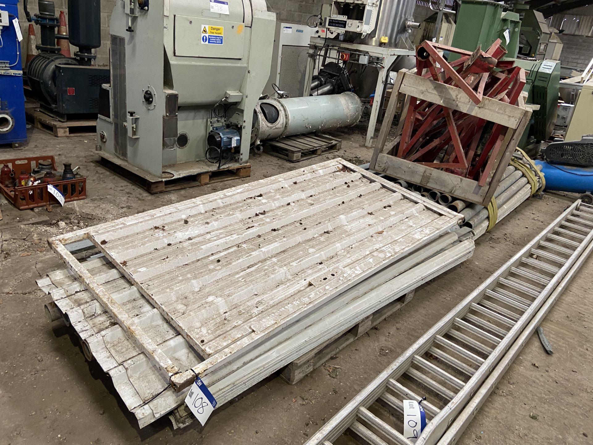 STEEL SHUTTERING PANELS, on two pallets, each approx. 1.1m wide x 2.5m high, with tubular posts