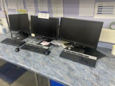 Three Flat Screen Monitors, with three keyboards and three mice Please read the following