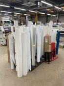 Two Fabricated Steel Roll Racks, with approx. 50 part rolls of laminated paper Please read the