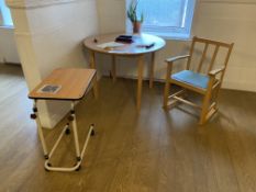 Two Circular Oak Laminated Tables, with armchair and mobile tray stand Please read the following