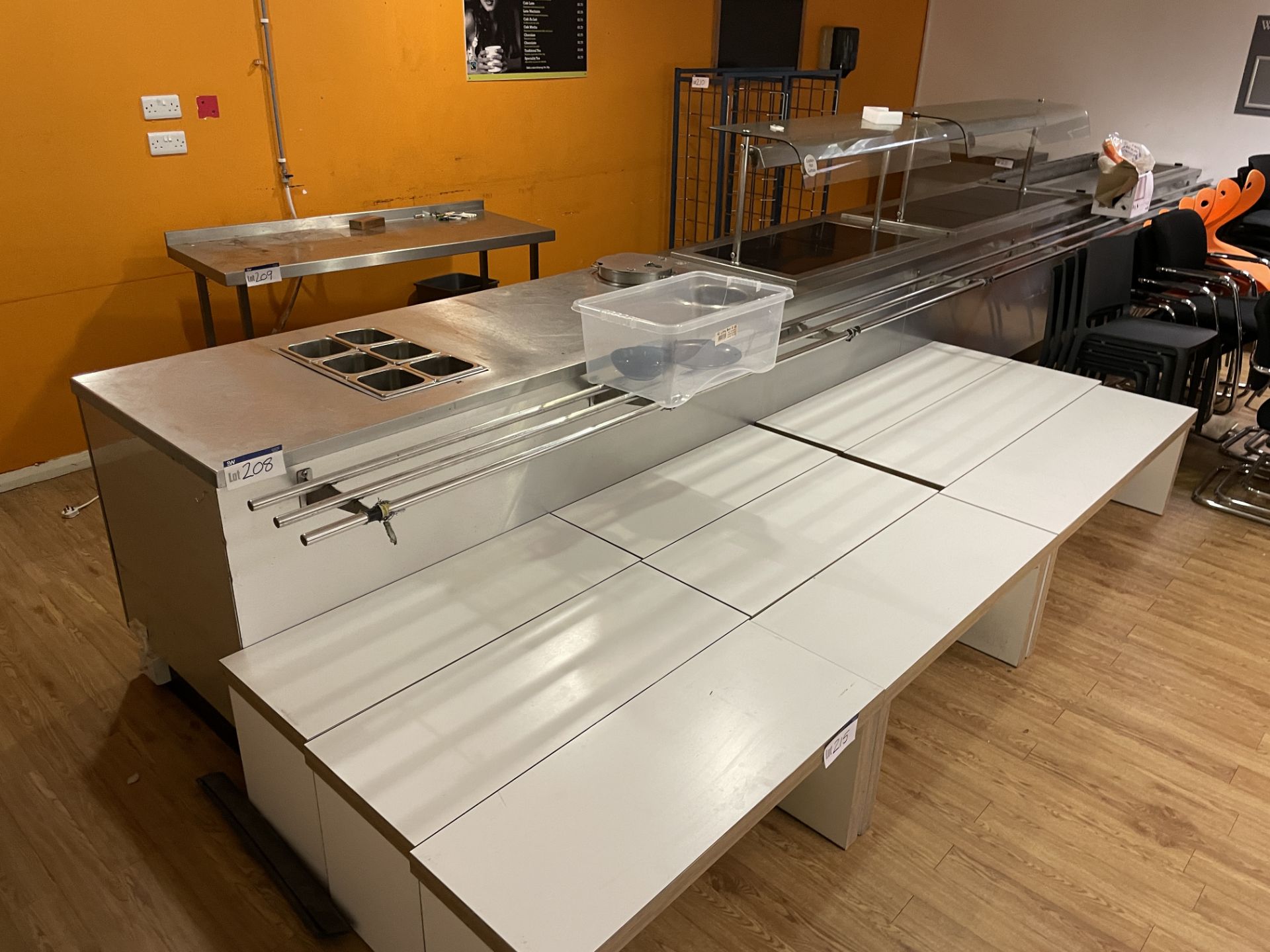 STAINLESS STEEL FOUR SECTION SERVERY, approx. 7.2m long, with hot cupboard, hot plate and heat