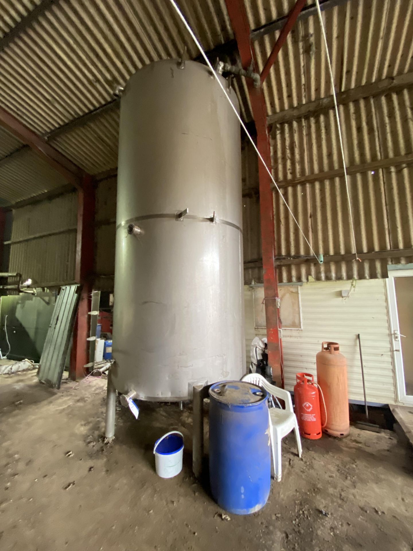 VERTICAL STAINLESS STEEL TANK, approx. 1.8m dia. x 4m deep (immediate piping only included) Please - Image 2 of 4