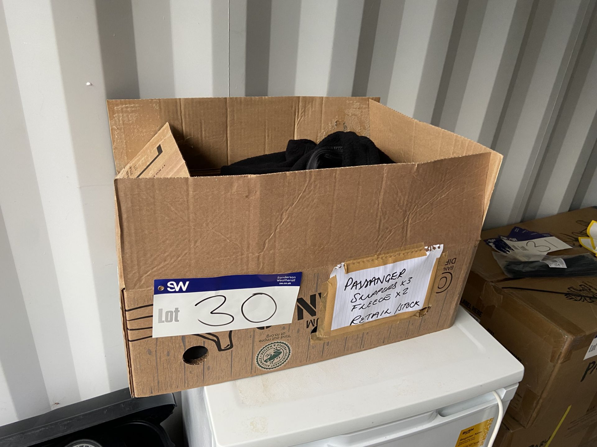 Passenger Clothing, including three pairs of slippers and two fleeces, in cardboard box Please