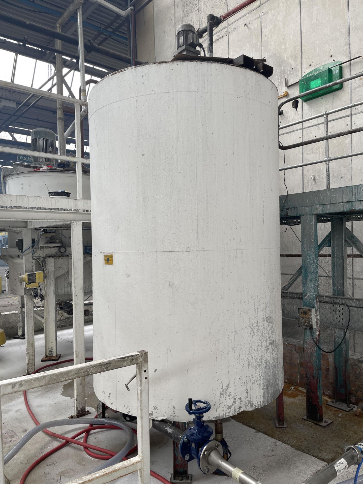 Steel Mixing Tank, approx. 2.95m high x 1.7m dia x 2.5m deep, with steel support legs (pipework