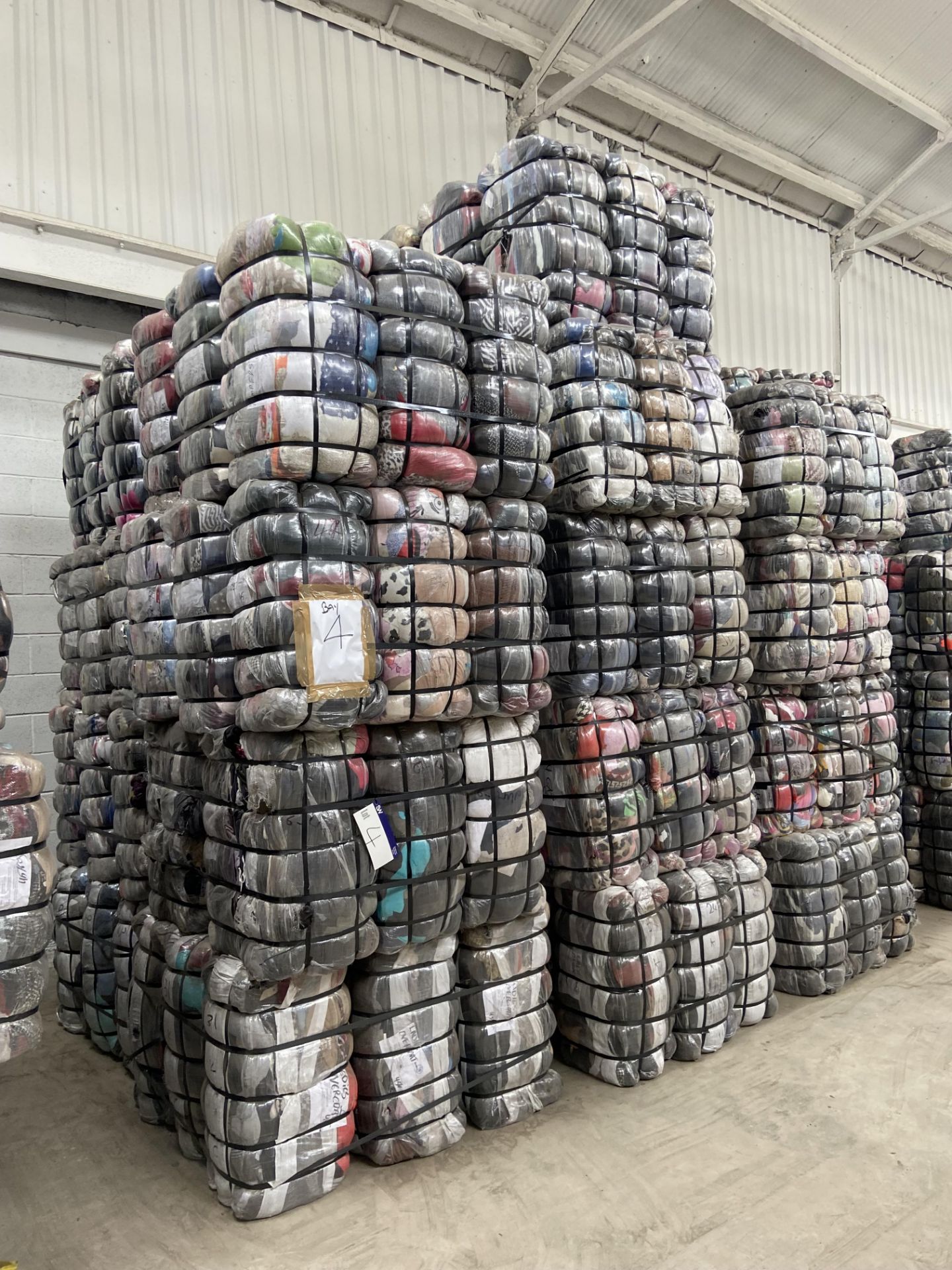 APPROX 197 BALES (8865KG) RECYCLABLE WASTE TEXTILES, understood to comprise: Three bales x 45kg