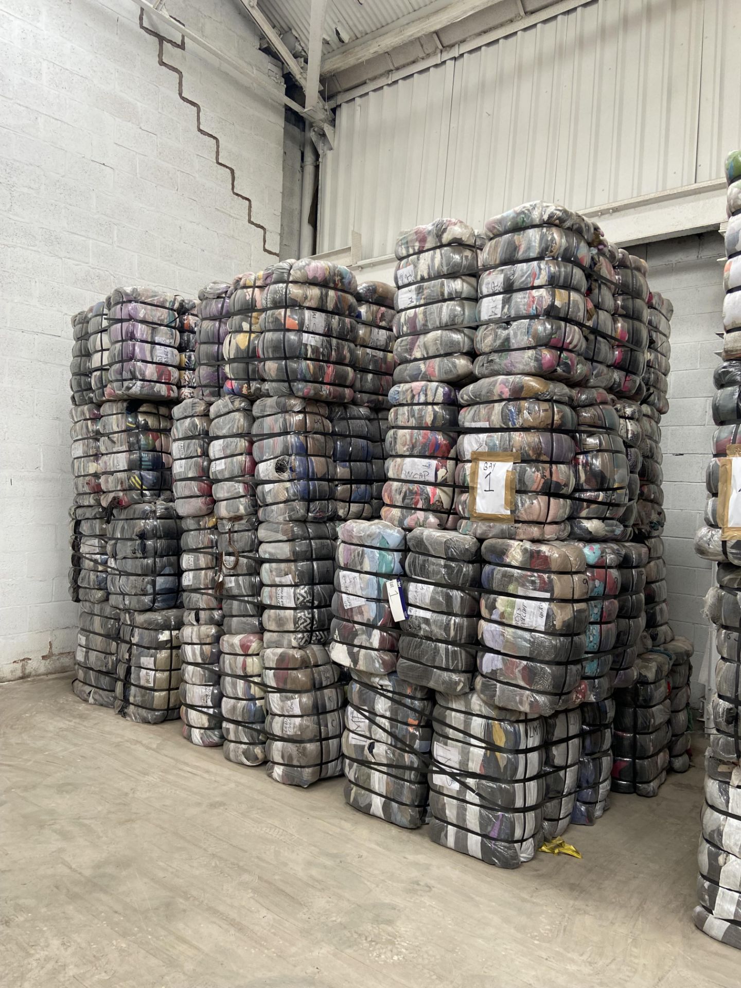 APPROX 197 BALES (8865KG) RECYCLABLE WASTE TEXTILES, understood to comprise: Six bales x 45kg Mens