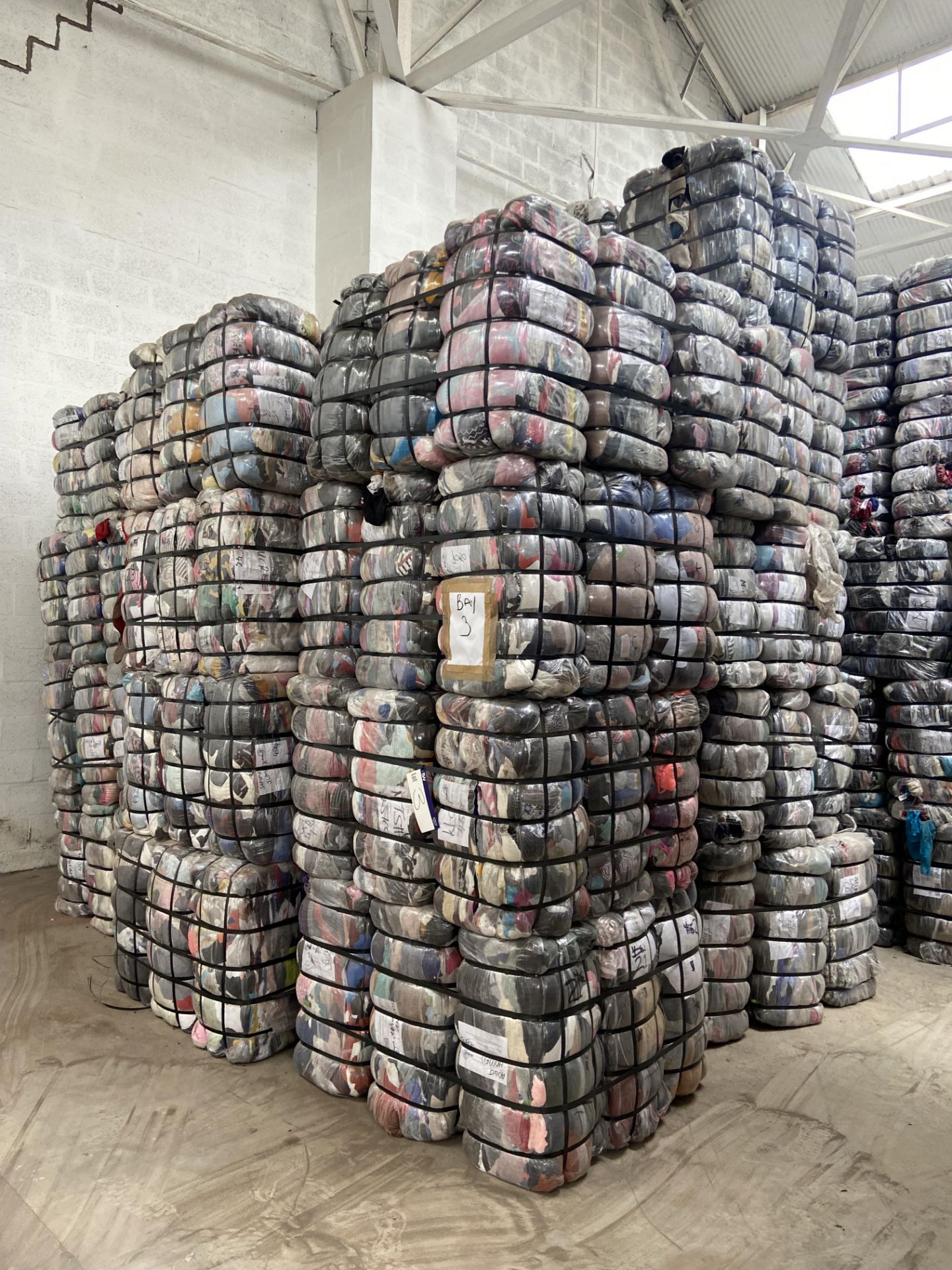 APPROX 211 BALES (9495KG) RECYCLABLE WASTE TEXTILES, understood to comprise: Three bale x 45kg