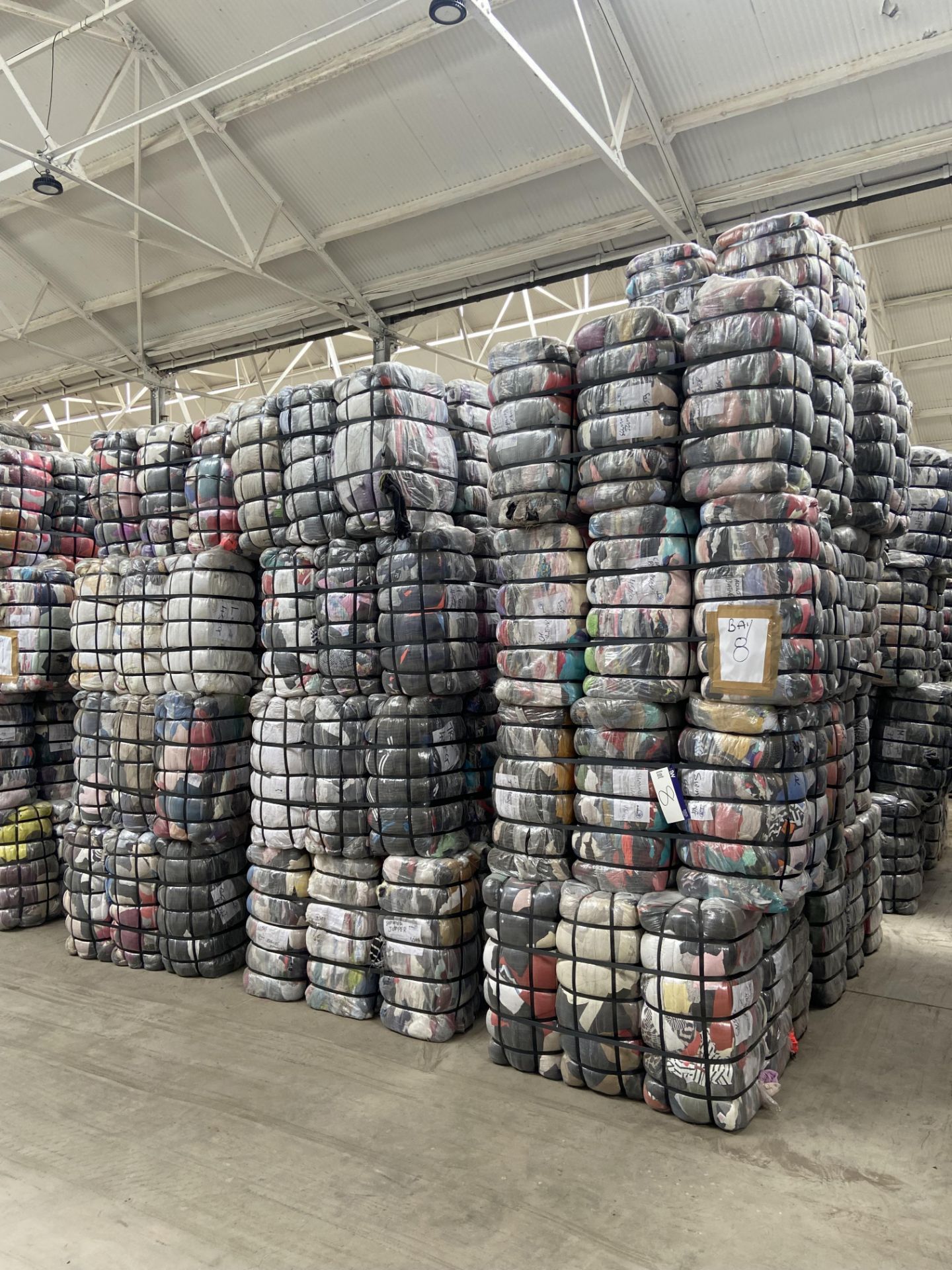 APPROX 215 BALES (9675KG) RECYCLABLE WASTE TEXTILES, Understood to comprise: Nine bales x 45kg Adult