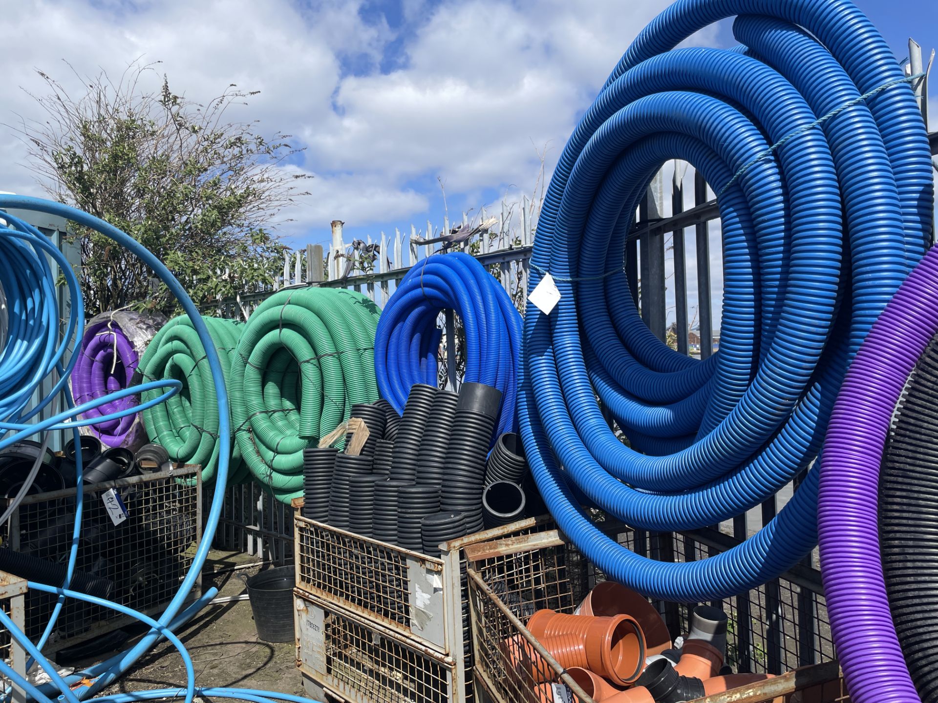 Coiled Flexible Piping, suspended off palisade fencing Please read the following important - Image 2 of 2