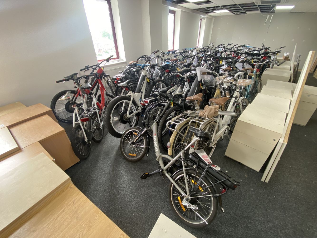 220 Road Legal Electric Bicycles (mainly new/ old stock, many boxed) & Ten Road Legal Electric Scooters