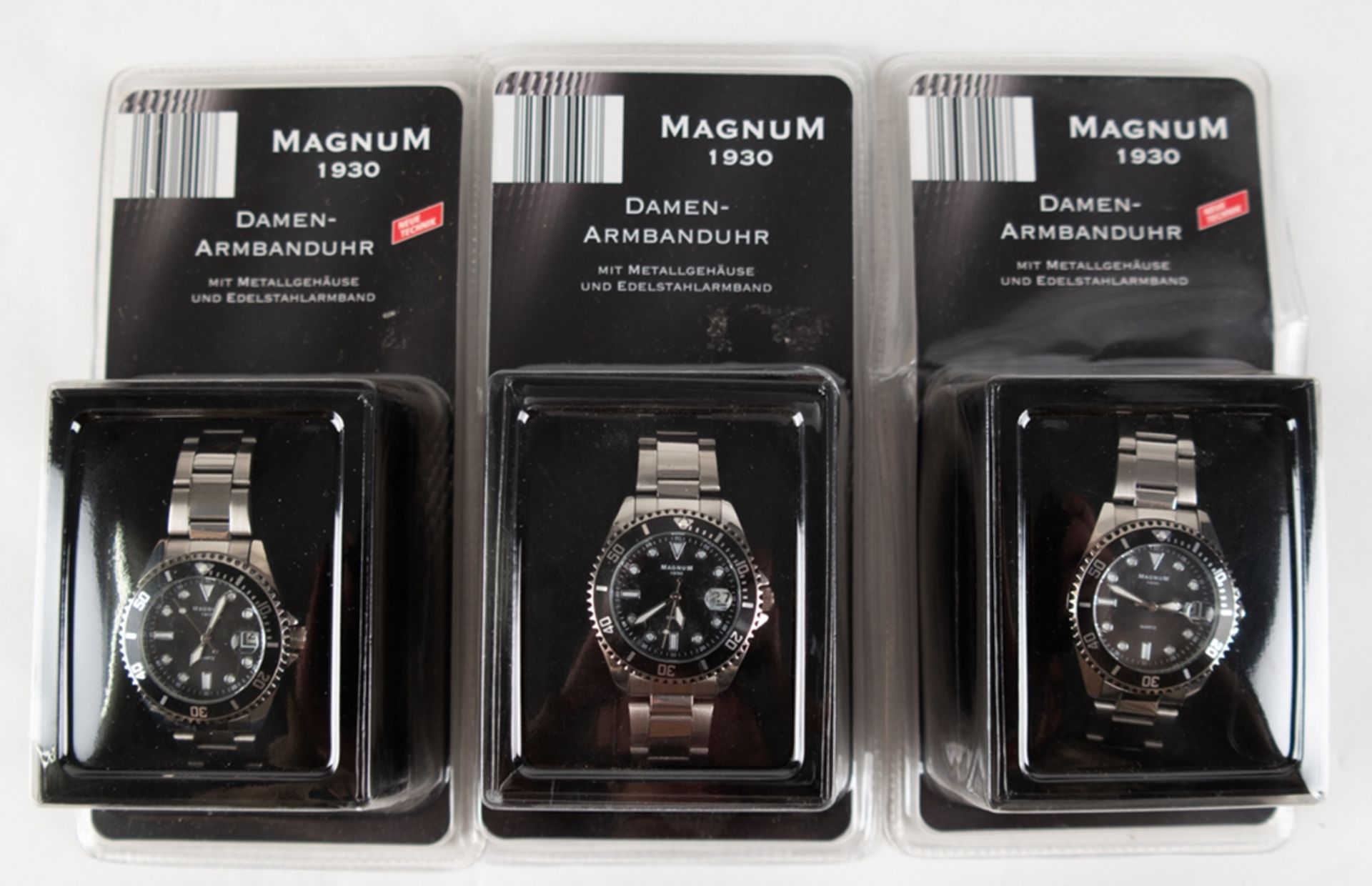3 Damen-Armbanduhren "Magnum 1930", Quarz, Metallgehäuse, Edelstahlarmband, blaues bzw. schwarzes Z