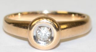 Ring, 585er GG, Christ, besetzt mit 1 Brillanten von 0,10 ct. (punziert), ges. 3,59 g, RG 52