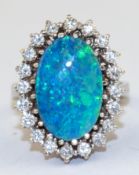 Brillant-Opal-Ring, 585er WG., 20 lupenreine Brillanten von zus. 0,845 ct., w, 1 ovale Opal-Doublet
