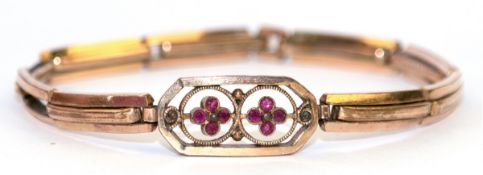 Jugendstil-Armband, Doublé, Mittelteil blütenförmig mit roten Schmucksteinen besetzt, flexibel, L. 