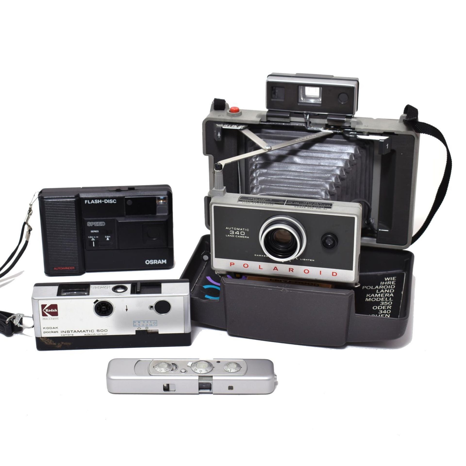 Vier Kameras. Polaroid / Kodak / Osram GmbH / Minox |
