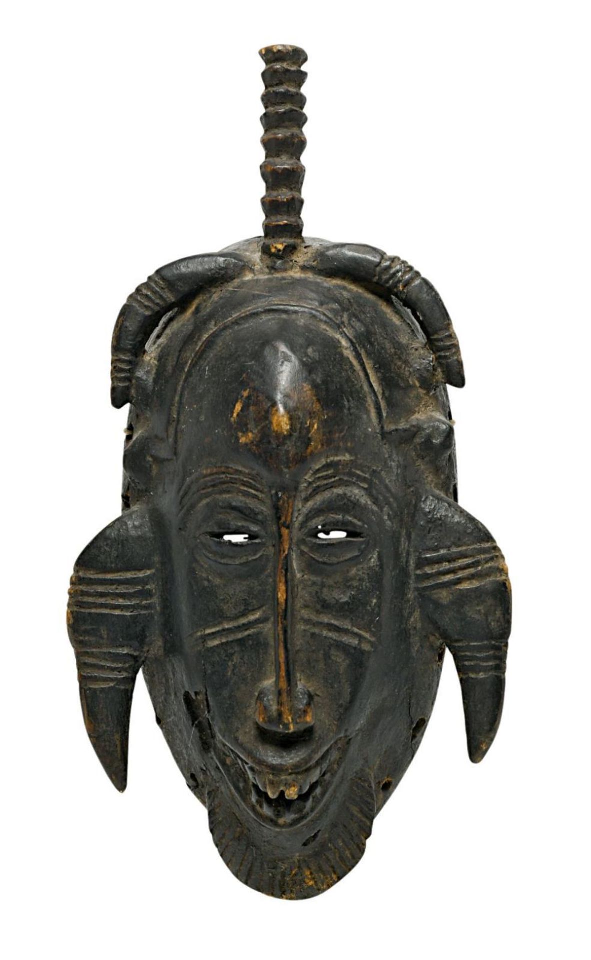 Kleine Maske. Senufo, Elfenbeinküste (wohl) | Holz, geschnitzt, dunkel patiniert.