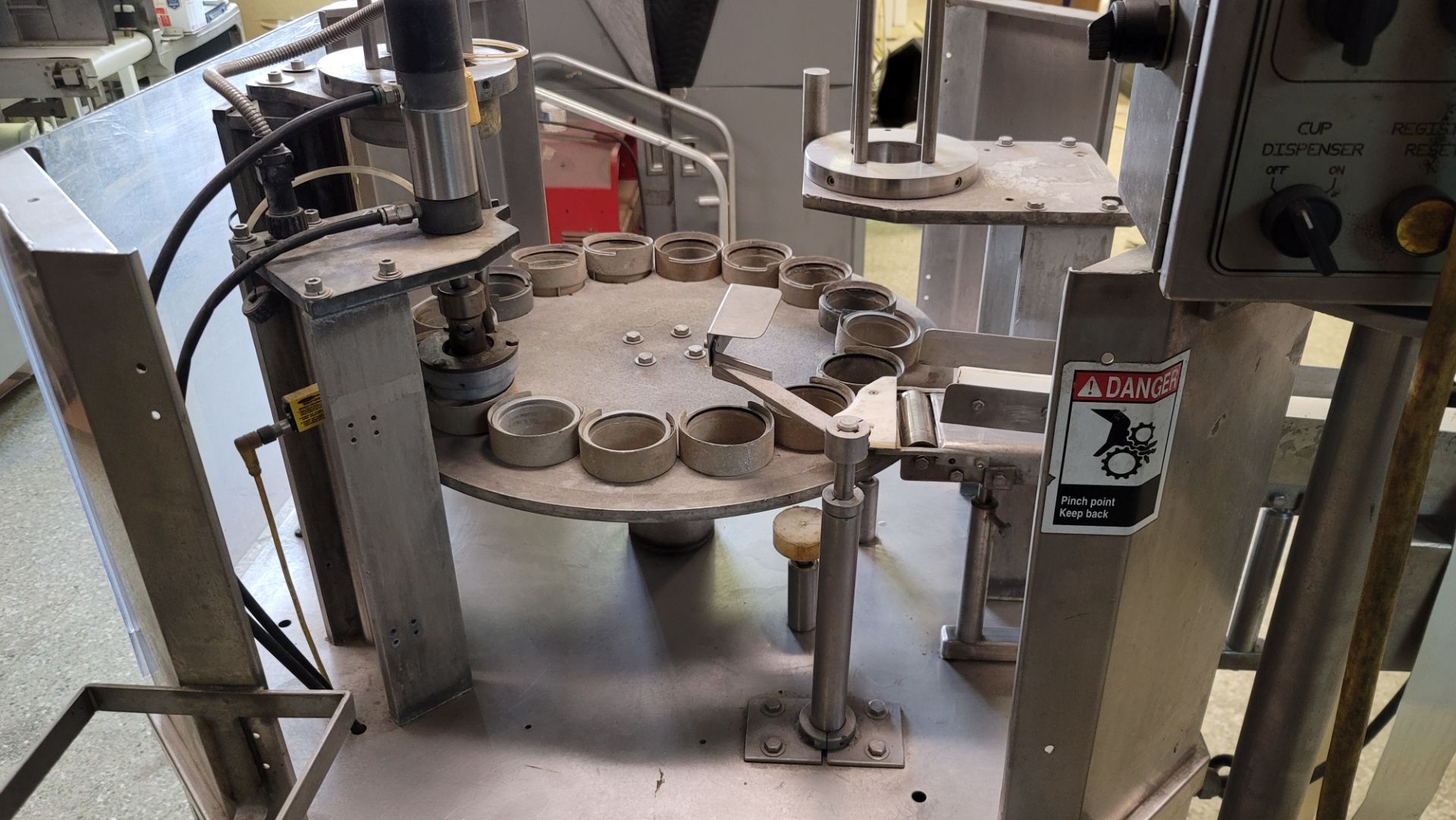 (Located in Belle Glade, FL) BWI HOLMATIC ROTARY CUP FILLER SEALER, Rigging/Loading Fee: $100 - Image 2 of 5