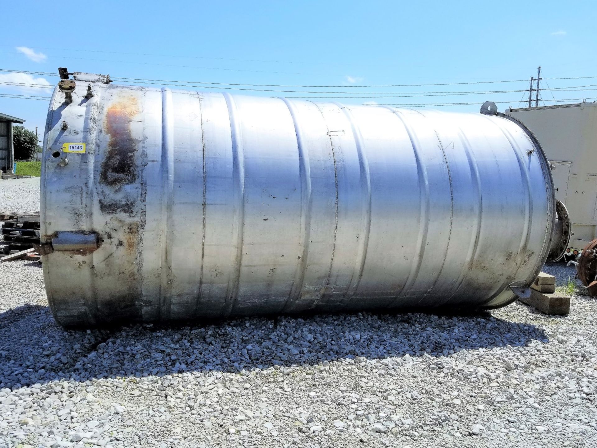 Lot Location: Greensboro NC Used 6000 Gallons 8ft. Diameter Stainless Steel Vertical Tank