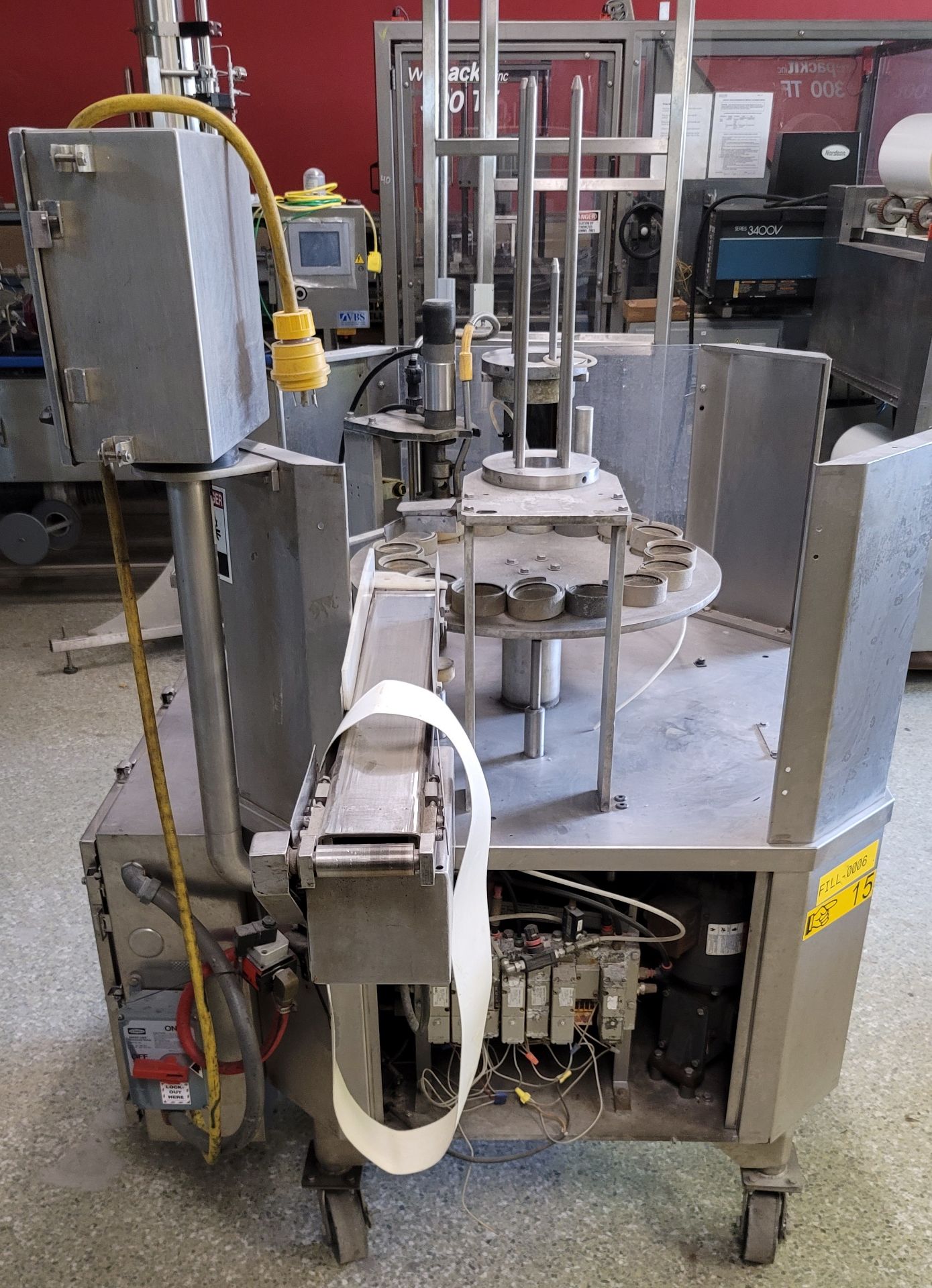 (Located in Belle Glade, FL) BWI HOLMATIC ROTARY CUP FILLER SEALER, Rigging/Loading Fee: $100