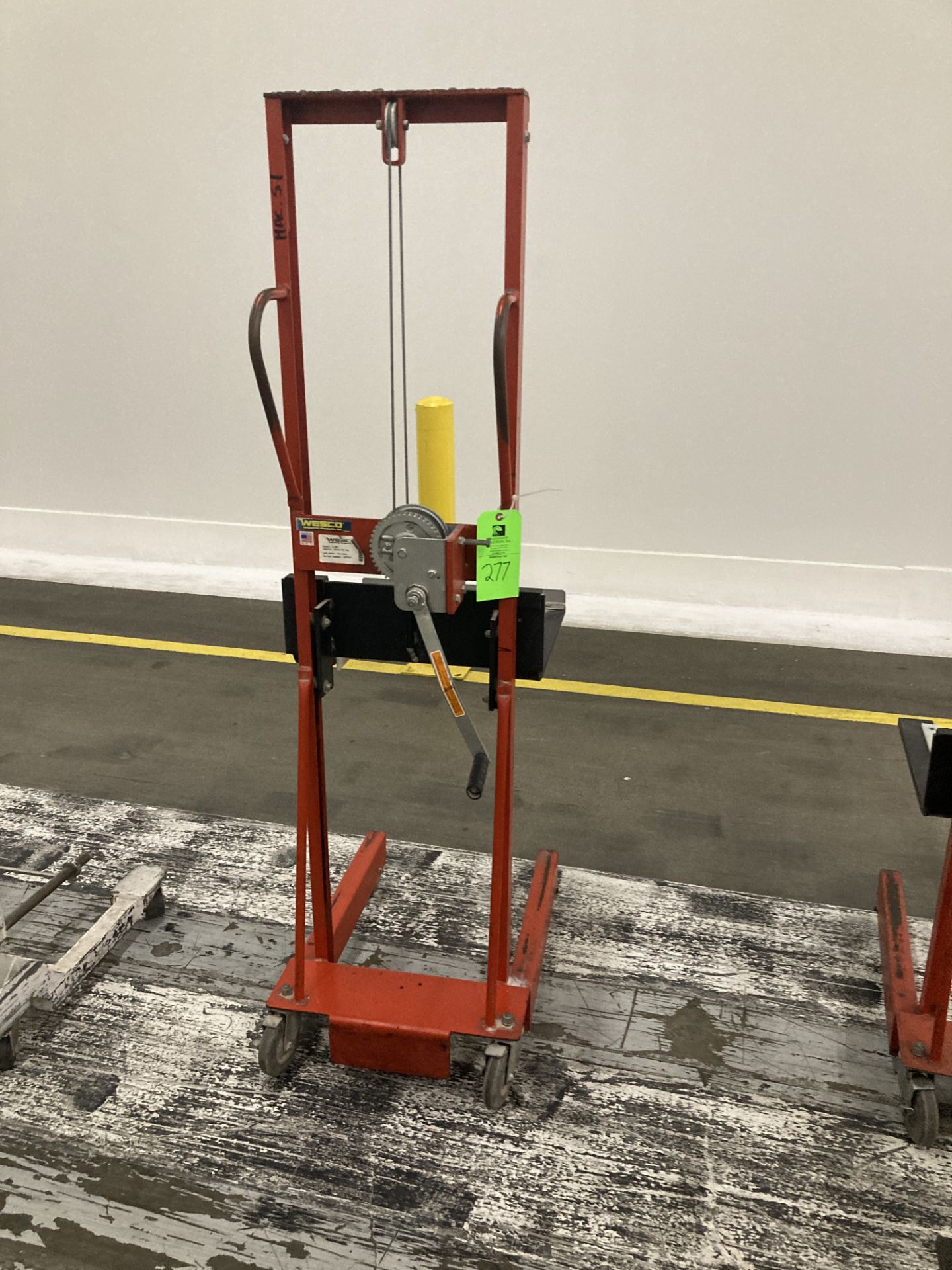 Wesco hand operated lift truck with straddle legs, approx. 500 lbs cap Rigging Fee: $ 50